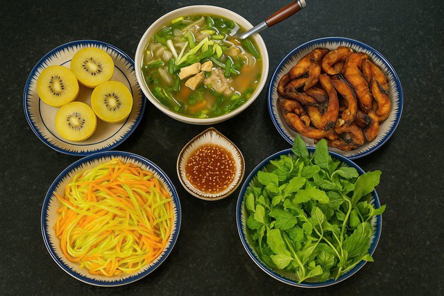 Món ăn ngon trong mâm cơm này có: Su hào xào cà rốt + cá chiên + canh + rau sống + kiwi tráng miệng.